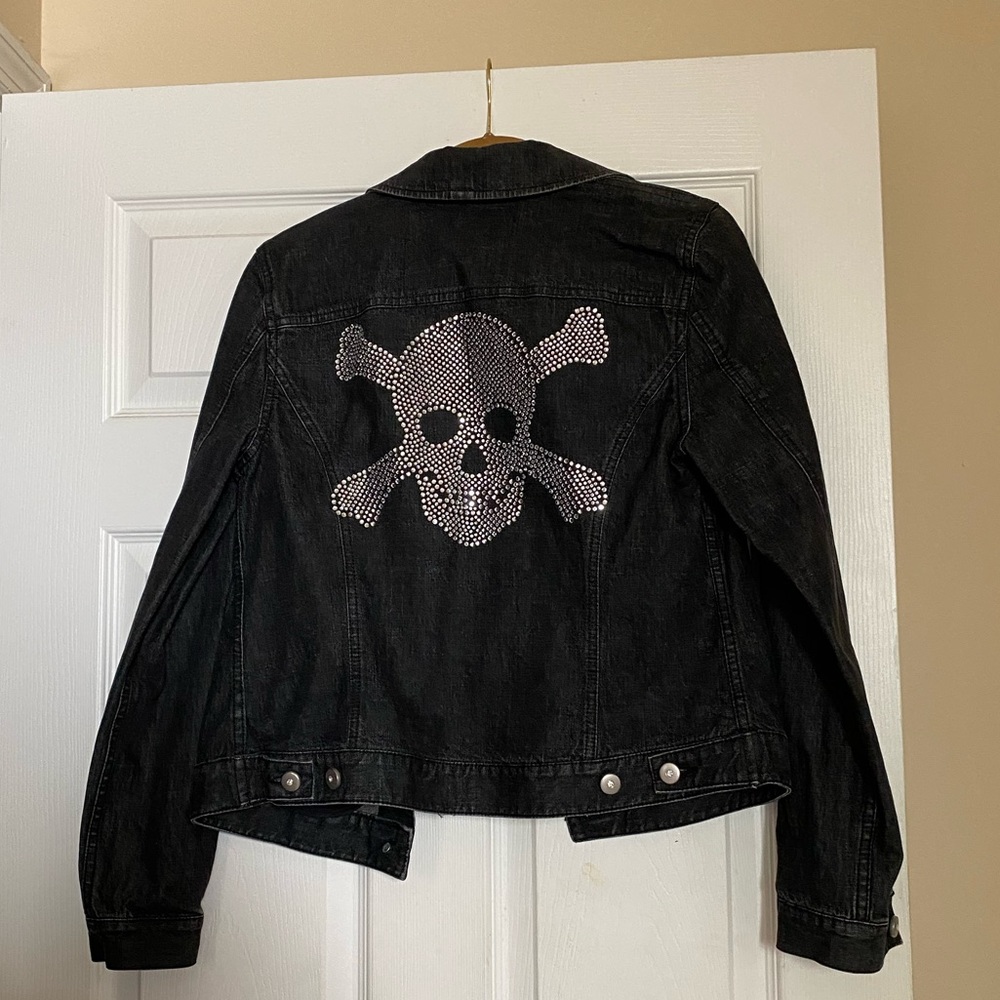 INC black denim jacket with embellished skull on back.